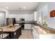 Bright kitchen featuring white cabinetry, granite countertops, tile flooring, and stainless steel appliances at 9360 E Milagro Ave, Mesa, AZ 85209