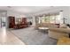 Open-concept living room with carpet and dining area with a large window offering great views of the neighborhood at 9360 E Milagro Ave, Mesa, AZ 85209