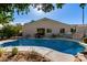 Private backyard pool surrounded by a spacious patio perfect for entertaining and relaxation at 9360 E Milagro Ave, Mesa, AZ 85209