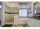 Well-lit bathroom showcasing a stylish shower, soaking tub, and a vanity with a dark countertop at 9404 W Pierson St, Phoenix, AZ 85037