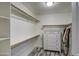 Walk-in closet with built-in shelving, hanging rods, and a dresser at 9404 W Pierson St, Phoenix, AZ 85037