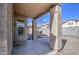 Back patio featuring large support posts and a view into the backyard at 9404 W Pierson St, Phoenix, AZ 85037