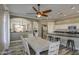 Open-concept design showcasing the dining area and kitchen, complemented by wood-look flooring and modern lighting fixtures at 9404 W Pierson St, Phoenix, AZ 85037