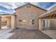 A shot of the back exterior featuring a covered patio and rock landscaping at 9404 W Pierson St, Phoenix, AZ 85037