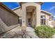 Inviting front entrance showcasing a decorative door, covered entry, and manicured bushes at 9404 W Pierson St, Phoenix, AZ 85037