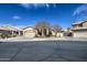 Inviting home with a two-car garage, mature landscaping, and a charming facade at 9404 W Pierson St, Phoenix, AZ 85037