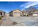 Charming home featuring a two-car garage and well-maintained landscaping at 9404 W Pierson St, Phoenix, AZ 85037