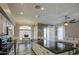 Bright kitchen with stainless steel appliances, white cabinets, and modern pendant lighting at 9404 W Pierson St, Phoenix, AZ 85037