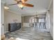 Living room showing wood-look flooring, chandelier, and bar area at 9404 W Pierson St, Phoenix, AZ 85037