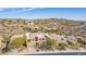 An aerial view shows houses with mountain views in a desert community at 9715 N Azure Ct # 4, Fountain Hills, AZ 85268