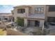 View of the backyard with patio, fire pit, outdoor kitchen area, and desert landscape at 9715 N Azure Ct # 4, Fountain Hills, AZ 85268