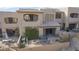 View of the backyard with patio, fire pit, outdoor kitchen area, and desert landscape at 9715 N Azure Ct # 4, Fountain Hills, AZ 85268