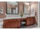 Bathroom vanity with dual sinks, decorative mirrors, and tiled countertops at 9715 N Azure Ct # 4, Fountain Hills, AZ 85268