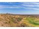 An elevated view shows desert community with lush green golf course and desert mountain views at 9715 N Azure Ct # 4, Fountain Hills, AZ 85268