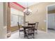 Cozy dining room features a chandelier and round table by a bright window at 9715 N Azure Ct # 4, Fountain Hills, AZ 85268