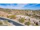 An exterior view of the home showcasing the desert landscaping and neighborhood at 9715 N Azure Ct # 4, Fountain Hills, AZ 85268