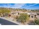 Tan two-story home with a tile roof in a desert community with mature trees at 9715 N Azure Ct # 4, Fountain Hills, AZ 85268