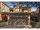 Charming two-story home with a neutral paint job and a two-car garage with green landscaping at 9715 N Azure Ct # 4, Fountain Hills, AZ 85268