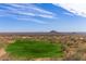 Beautiful golf course view featuring lush greenery, desert landscape, and a distant mountain under a blue sky at 9715 N Azure Ct # 4, Fountain Hills, AZ 85268