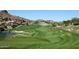 Expansive view of the pristine green golf course with sand traps and lush landscaping at 9715 N Azure Ct # 4, Fountain Hills, AZ 85268