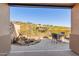 A desert landscape accentuates this outdoor living space with a patio and water feature at 9715 N Azure Ct # 4, Fountain Hills, AZ 85268