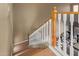 Staircase with wooden treads and white railing leads to a bright and airy living space at 9715 N Azure Ct # 4, Fountain Hills, AZ 85268