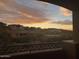 Sunset view from a balcony overlooking houses on a hillside at 9715 N Azure Ct # 4, Fountain Hills, AZ 85268