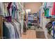 Organized walk-in closet with shelving units and hanging rods at 9715 N Azure Ct # 4, Fountain Hills, AZ 85268