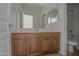 Bathroom with vanity, toilet and a large mirror at 1016 E Saddleback Pl, San Tan Valley, AZ 85143