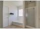 Bathroom with tile flooring features a shower, soaking tub and natural light at 1016 E Saddleback Pl, San Tan Valley, AZ 85143