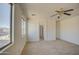 Bedroom features two large windows, neutral carpet, and white walls at 1016 E Saddleback Pl, San Tan Valley, AZ 85143