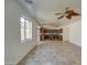 Open-concept living space featuring tile flooring and seamless transition to the kitchen at 1016 E Saddleback Pl, San Tan Valley, AZ 85143