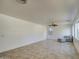 Open living room showcasing tile floors, ample space, and neutral tones at 1016 E Saddleback Pl, San Tan Valley, AZ 85143