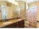 Bright bathroom featuring double sinks and granite countertops at 10657 E Evergreen St, Mesa, AZ 85207