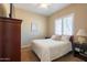 Bedroom with large window and dresser at 10657 E Evergreen St, Mesa, AZ 85207