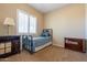 Bedroom with window and closet at 10657 E Evergreen St, Mesa, AZ 85207