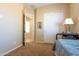 Bedroom leading to other room, and white closet doors at 10657 E Evergreen St, Mesa, AZ 85207