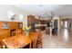 Open-concept kitchen and dining area with stainless steel appliances and tile flooring at 10657 E Evergreen St, Mesa, AZ 85207