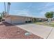 Spacious home exterior showcasing a large driveway and well-kept landscaping at 10701 W Mountain View Rd, Sun City, AZ 85351