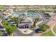 Aerial view showcasing tennis courts, a clubhouse, and well-maintained landscaping at 11413 E Neville Ave, Mesa, AZ 85209