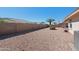 Spacious backyard offering privacy with desert landscaping and a view of the surroundings at 11413 E Neville Ave, Mesa, AZ 85209