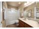 Bathroom with a shower-tub combo and a wooden vanity at 11413 E Neville Ave, Mesa, AZ 85209