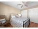 Comfortable bedroom with ceiling fan, wood floors, and closet at 11413 E Neville Ave, Mesa, AZ 85209