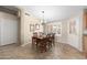 Cozy dining area with wood table, seating for four, and bright natural light at 11413 E Neville Ave, Mesa, AZ 85209