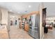 Spacious kitchen features stainless steel appliances and a view into other rooms at 11413 E Neville Ave, Mesa, AZ 85209