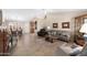 Inviting living room featuring tile floors, a ceiling fan, and an open layout perfect for entertaining at 11413 E Neville Ave, Mesa, AZ 85209