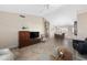 Spacious living room with tile floors, high ceilings, and an open floor plan to the dining area at 11413 E Neville Ave, Mesa, AZ 85209