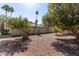 Expansive backyard with fruit trees and desert landscaping providing a scenic and private outdoor living space at 11830 S Paiute St, Phoenix, AZ 85044