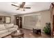 Comfortable living room with neutral color walls, wood floors, and plenty of natural light at 11830 S Paiute St, Phoenix, AZ 85044