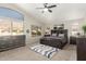 Spacious main bedroom with a vaulted ceiling and large windows offering natural light and scenic views at 1202 E Desert Broom Way, Phoenix, AZ 85048